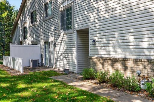 End-unit location offers added green space and beautiful mature trees.