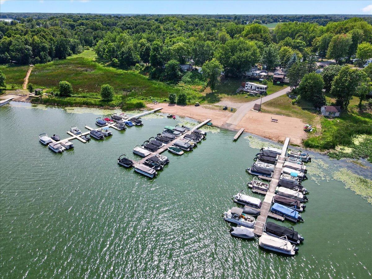 Aerial view captures the marina and extensive dock system extending into the lake.