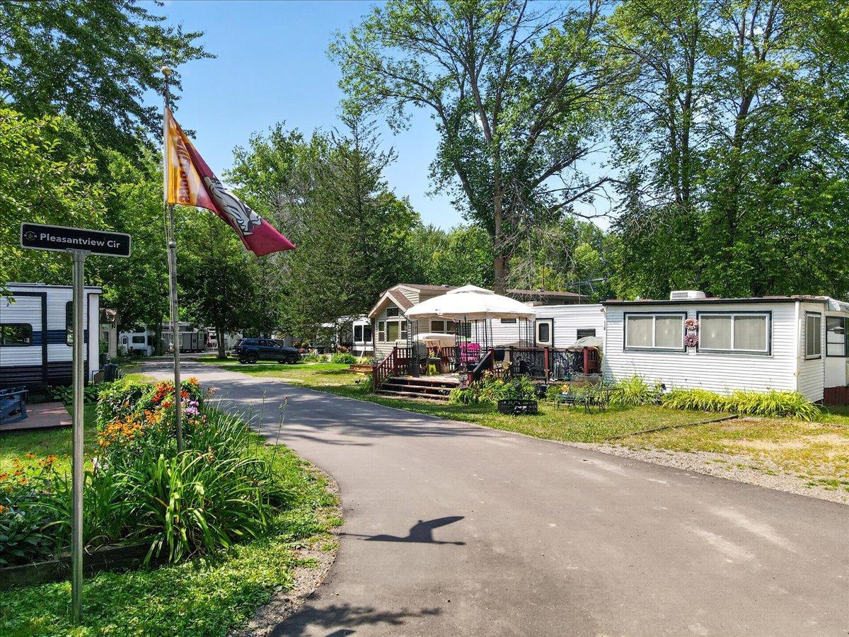 Another view of the established RV community highlights paved roads, mature landscaping, and seasonal sites.