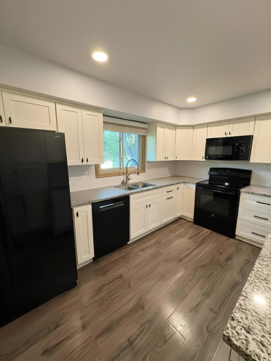 Fully remodeled in 2021, this impressive kitchen has lots of counter space, beautiful granite countertops and a window that allows the light in to warm-up the space