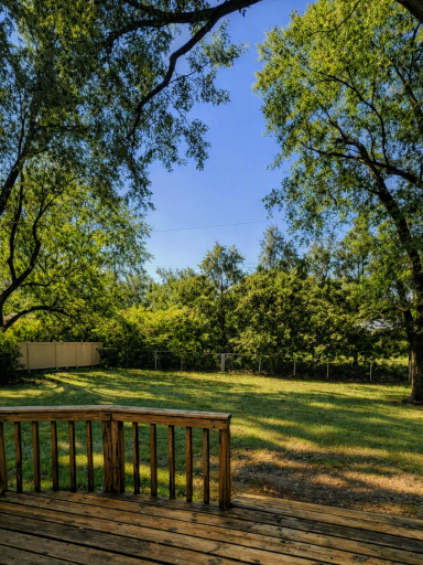 This home opens up to a large and private fully fenced in flat backyard