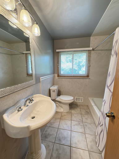 Remodeled in 2023, the main floor full bath is bright, clean and welcoming