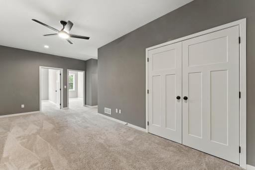 The upper level has a wonderful loft area. Notice the paneled doors throughout the home