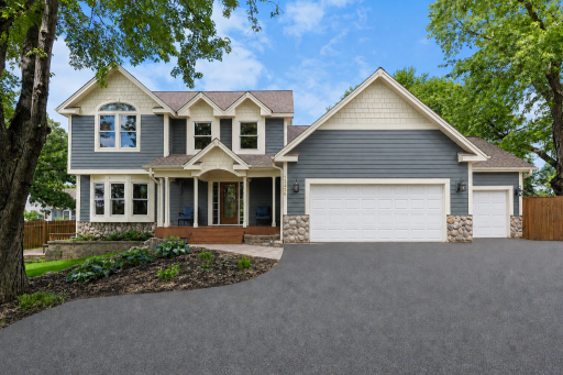 Welcome Home! Â This 6 bedroom, 4 bath home is amazing for entertaining - both inside and out!Â  With TWO kitchens, updated appliances, a screen porch, gorgeous landscaping, newer roof... the list goes on and on!