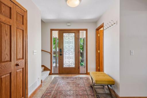 Come inside! Â Greet family and friends through the foyer - stairs to the main bedroom area are on one side, and to the other is the primary suite.