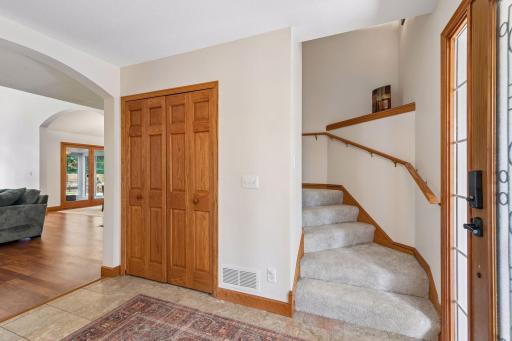 There is a convenient entry closet located near the entryway, and next to the stairs going up to the main sleeping area.