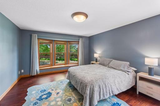 The large primary suite boasts a beautiful bay window that overlooks the front landscaping.