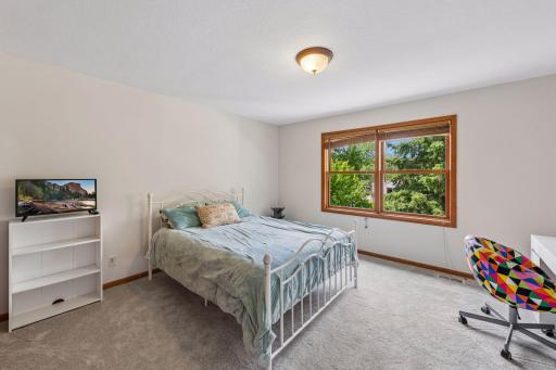 The second of three upper level bedrooms.