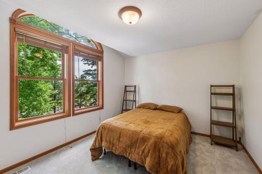 The third bedroom on the upper level is also generously sized and has large windows and a large closet.