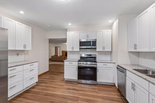 Stainless appliances and heated floors in the lower level!