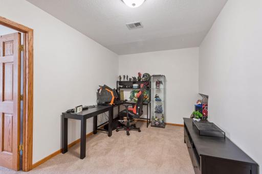 This space off of the kitchen area is perfect as an office nook, study area, or workout space.