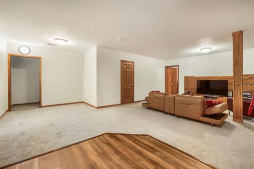 The stairs open into this beautiful finished basement with a FULL kitchen, living room, full bathroom, and 2 bedrooms.