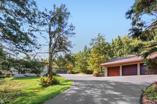 9900 Primrose Ave N Long view approach to home & outbuilding