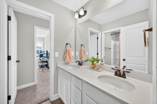 Upper Level Jack and Jill Bathroom with Double Sinks and Private Space for Vanity.