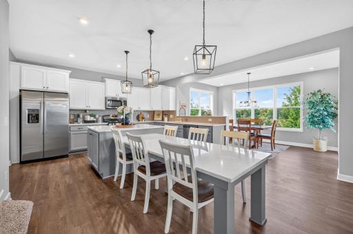 Beautiful Kitchen with Stainless Steel Appliances, Large Island (including seating) and Abundant Storage.