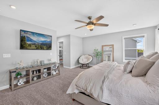 Primary Bedroom with Ensuite and Dual Walk-In Closets.