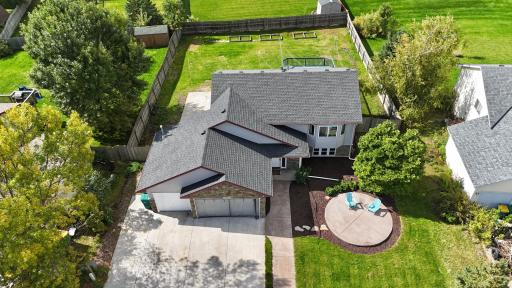 Great green space! Circular patio in front yard, additional patio on south side of home in back yard. Spacious deck and fenced yard!