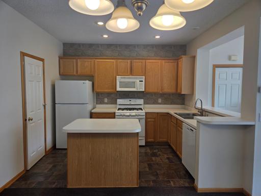 Kitchen Island, gas stove top, microwave, fridge and dishwasher