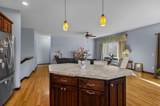 Kitchen center island and natural hardwood floors!.JPG