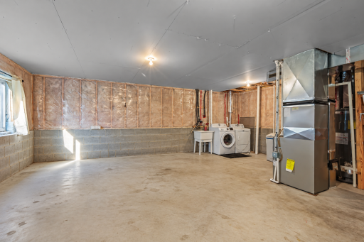 Unfinished lower level is ready for your finishing touches, or use as a game room! (3).png