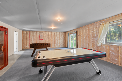 Unfinished lower level is ready for your finishing touches, or use as a game room! (1).png