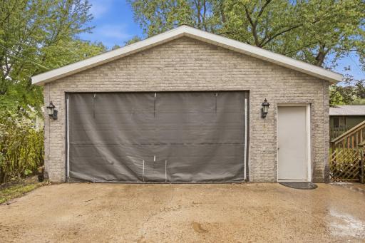 The insulated overhead garage door is paired with a ½-horsepower opener, and a Velcro-attached screen allows the garage door to stay open on beautiful days while helping keep the bugs outside.