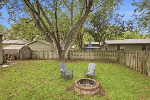 A fenced in backyard offers privacy and space to enjoy the outdoors.