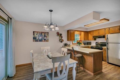 The dining area offers direct access to the deck through patio doors with convenient built-in blinds between the panes.