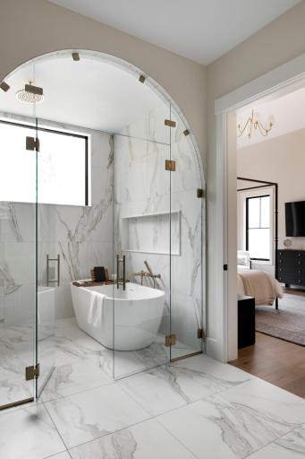 Primary Ensuite Bath Wet room - Shower & Soaking Tub with arched opening & glass doors; zero transition entry