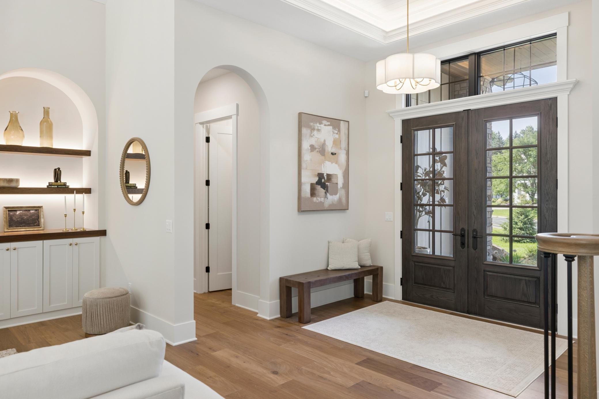 Spacious Foyer with ceiling detail and accent lighting