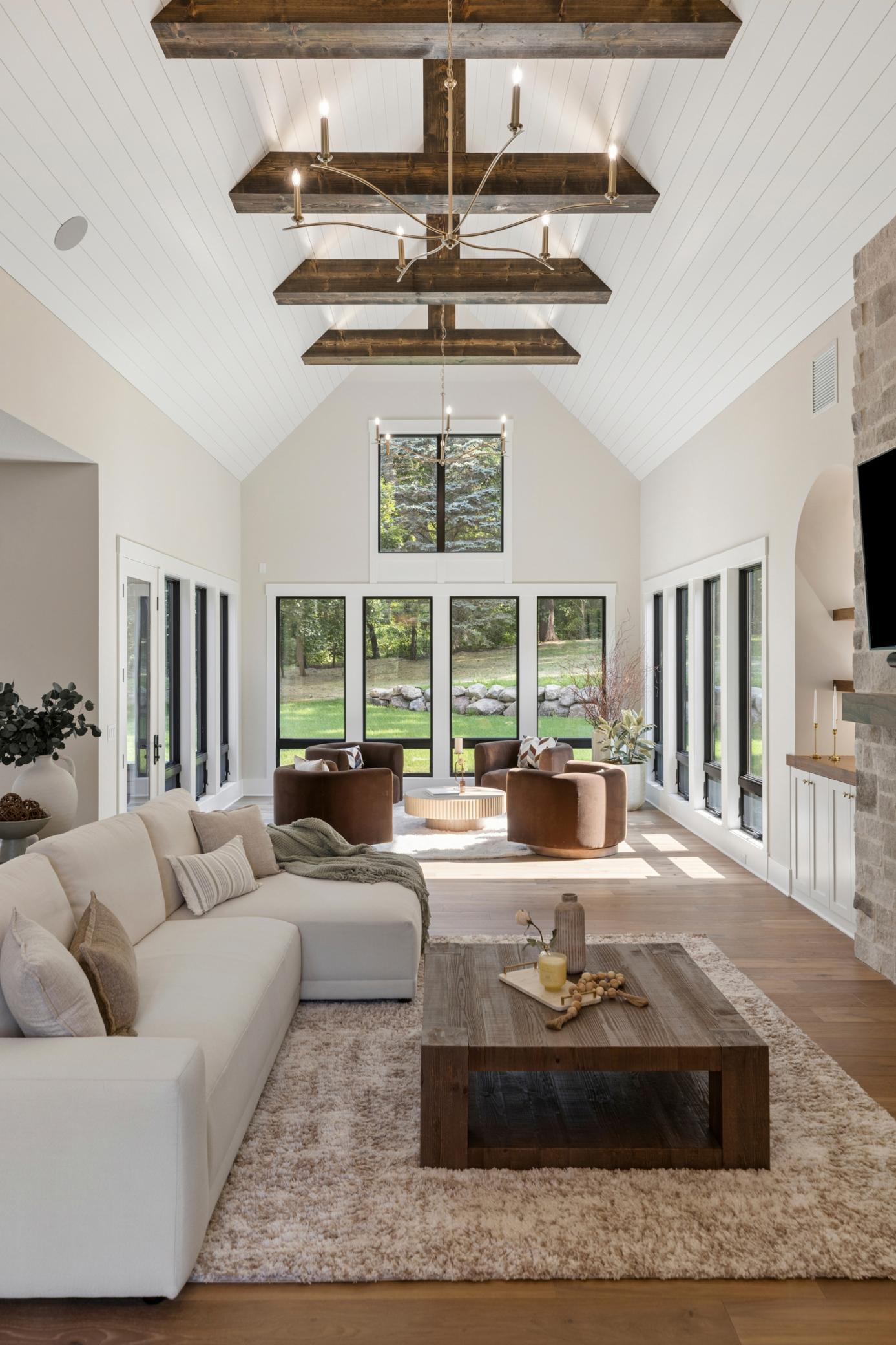 Grand ceilings with beams and accent lighting