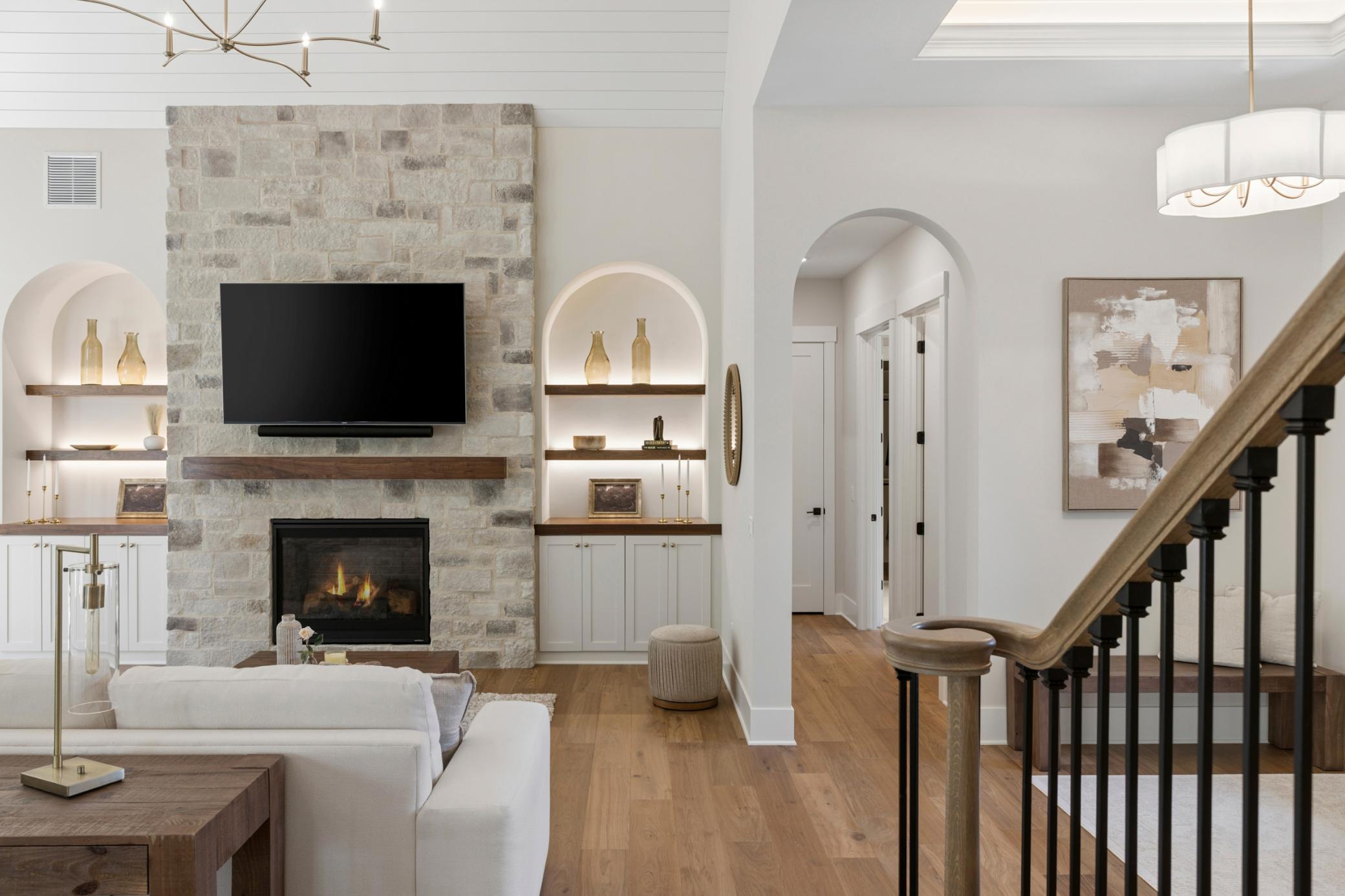 Arched built-ins with arched openings & staircase
