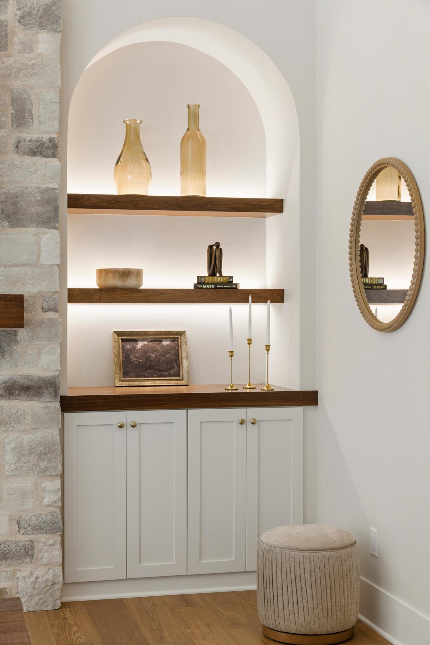 Arched built-ins with accent lighting