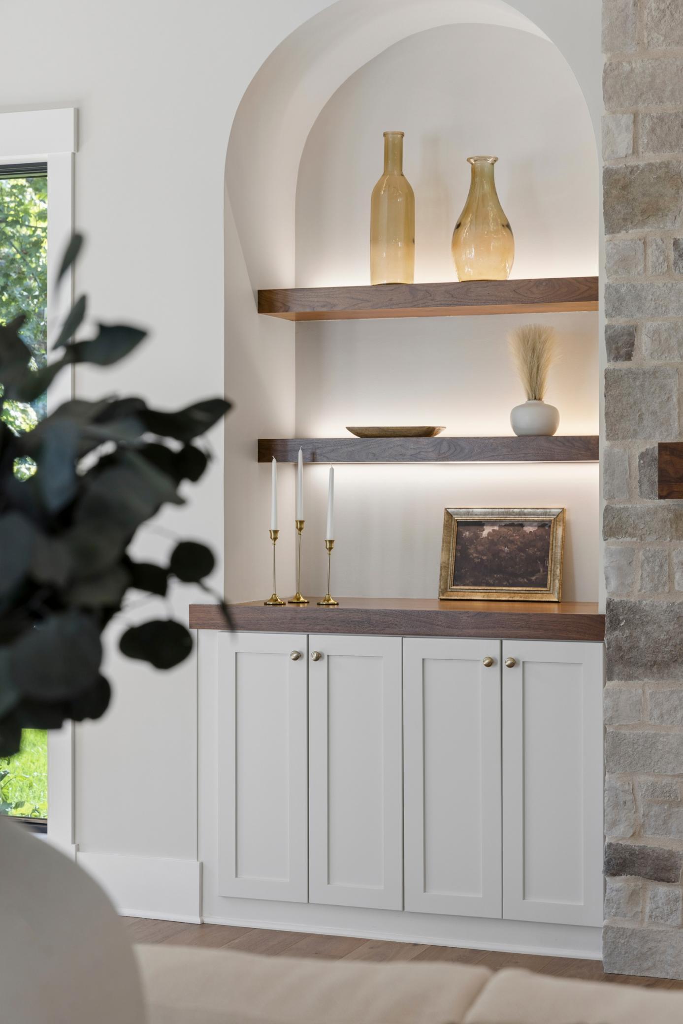 Arched built-ins with accent lighting