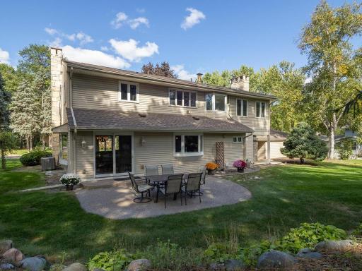 The backyard patio is very private surrounded by "bermed" areas with shrubs professionally landscaped.