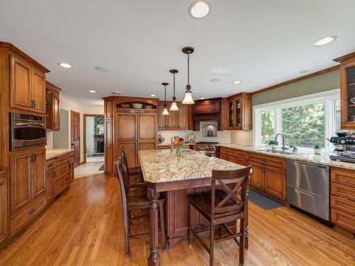 The 2 drawer dishwasher makes it flexible to use 1 drawer at a time or both for large parties. Gas stove is dual fuel gas stovetop and electric oven. Refrigerator/freezeer is hidden behind custom panels back left of center island.