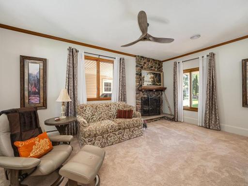 This cozy family room located to left of front foyer. Wood fireplace not used except for decorative purposes.
Large custom ceiling fan too!