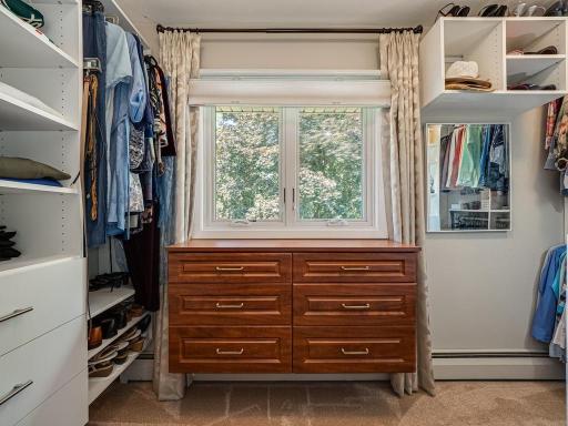 Owners Suite primary closet features custom designed organizers for your clothes/shoes . The large double window lets in plenty of natural light!