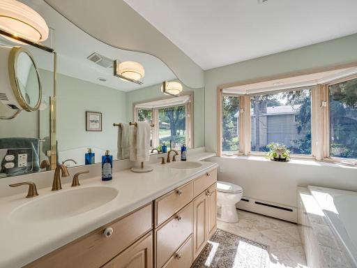 Upper floor full bathroom has been updated featuring dual sinks , whirlpool jetted tub and seperate walk-in shower!