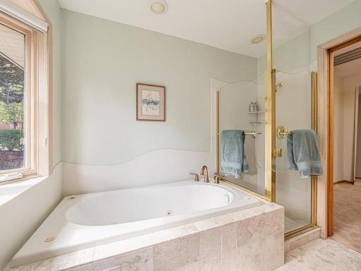 Upstairs main bathroom features jetted tub and walk-in shower!