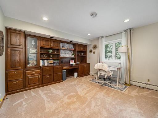 2nd bedroom upstairs is extra spacious with plenty of custom built-ins . It is currently used as an office.