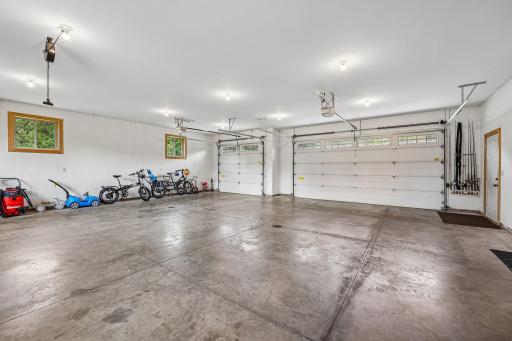34 x 32 Finished, insulated, heated garage with hot/cold water and wired 220 - 8 foot high garage doors