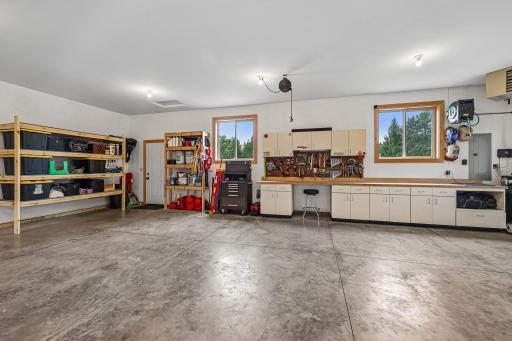 34 x 32 Finished, insulated, heated garage with hot/cold water and wired 220