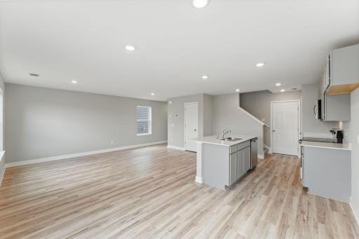 The open concept main level is great for entertaining and everyday living. Photo of spec home, colors and finished may vary.