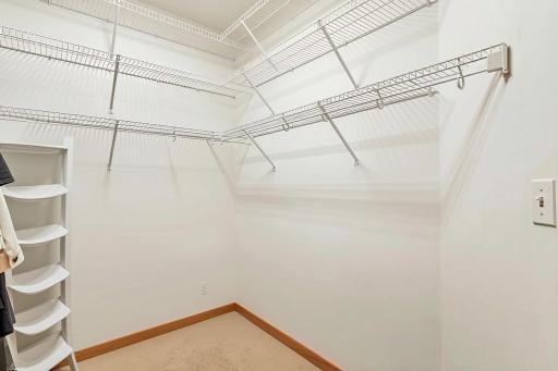 Primary bedroom walk-in closet