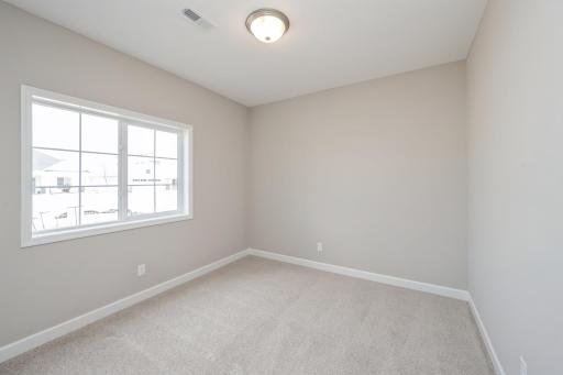 Bedroom 1 - photos are of a completed inventory home of the same floorplan. Colors and selections may differ.