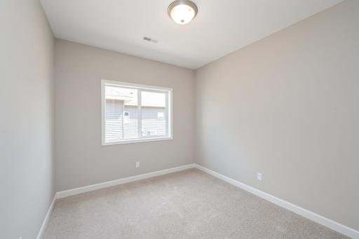 Bedroom 2 - photos are of a completed inventory home of the same floorplan. Colors and selections may differ.