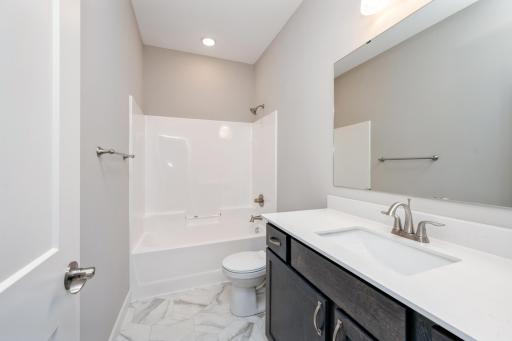 Full bathroom - photos are of a completed inventory home of the same floorplan. Colors and selections may differ.