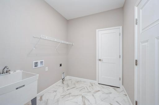 Mud/Laundry room - photos are of a completed inventory home of the same floorplan. Colors and selections may differ.