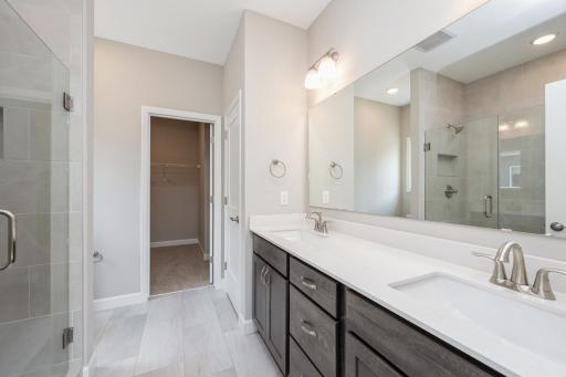Primary suite luxury bathroom - photos are of a completed inventory home of the same floorplan. Colors and selections may differ.